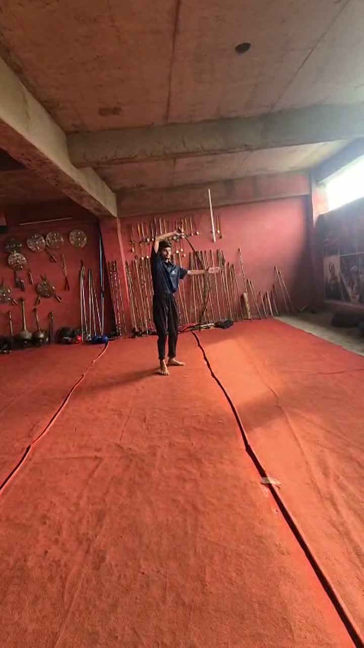 Weapon training practice on the dojo mat